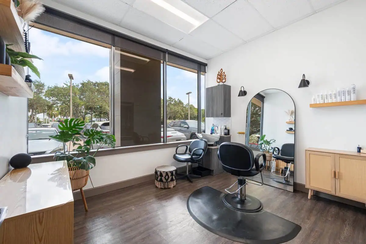 Salon chair by window representing one of the most profitable business ideas.